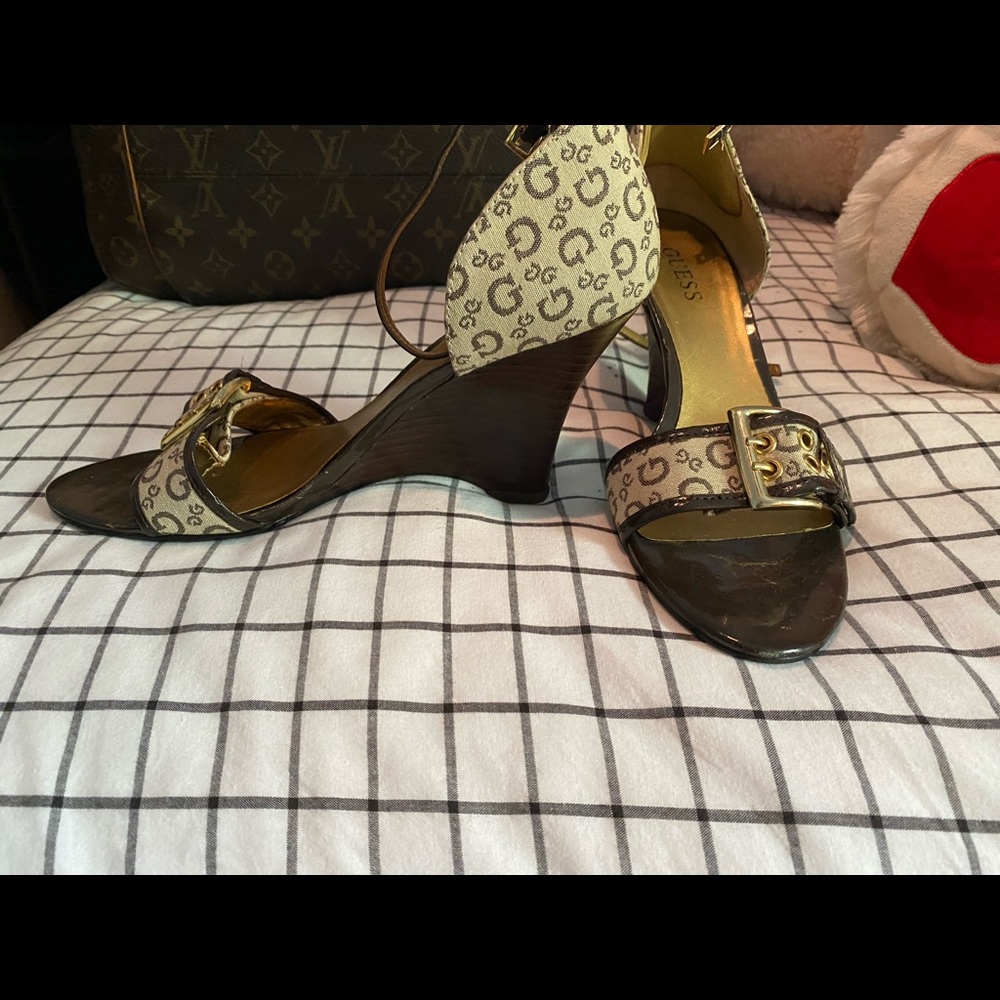 Guess shoe brand open toes with guess logo on it